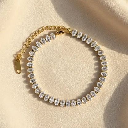 Gold tennis bracelet features sparkling stones set in a sleek gold-plated design. It is anti-tarnish and lightweight.