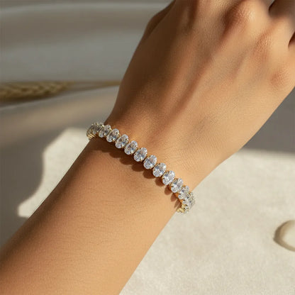 Gold tennis bracelet features sparkling stones set in a sleek gold-plated design. It is anti-tarnish and lightweight.