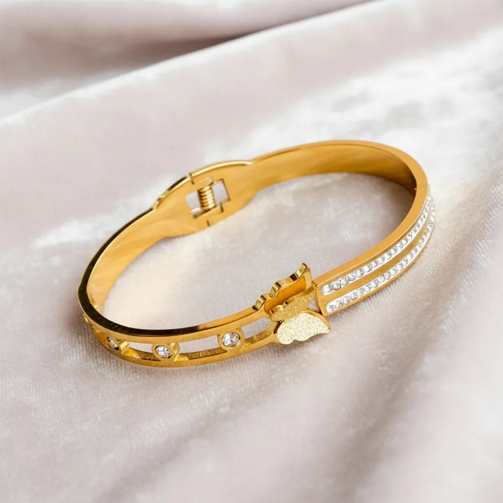 Dazzle Link Bracelet is a stylish gold bracelet for women, crafted with a sleek linked design and sparkling stone accents.