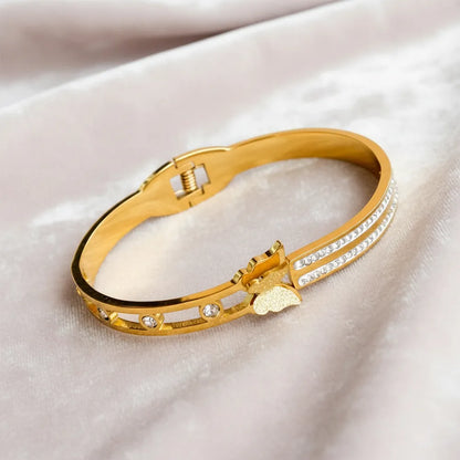 Dazzle Link Bracelet is a stylish gold bracelet for women, crafted with a sleek linked design and sparkling stone accents.