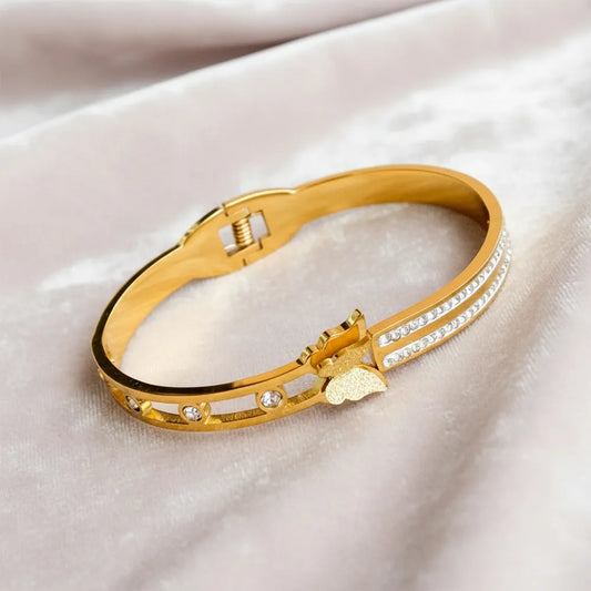 Dazzle Link Bracelet is a stylish gold bracelet for women, crafted with a sleek linked design and sparkling stone accents.