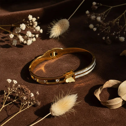 Dazzle Link Bracelet is a stylish gold bracelet for women, crafted with a sleek linked design and sparkling stone accents.