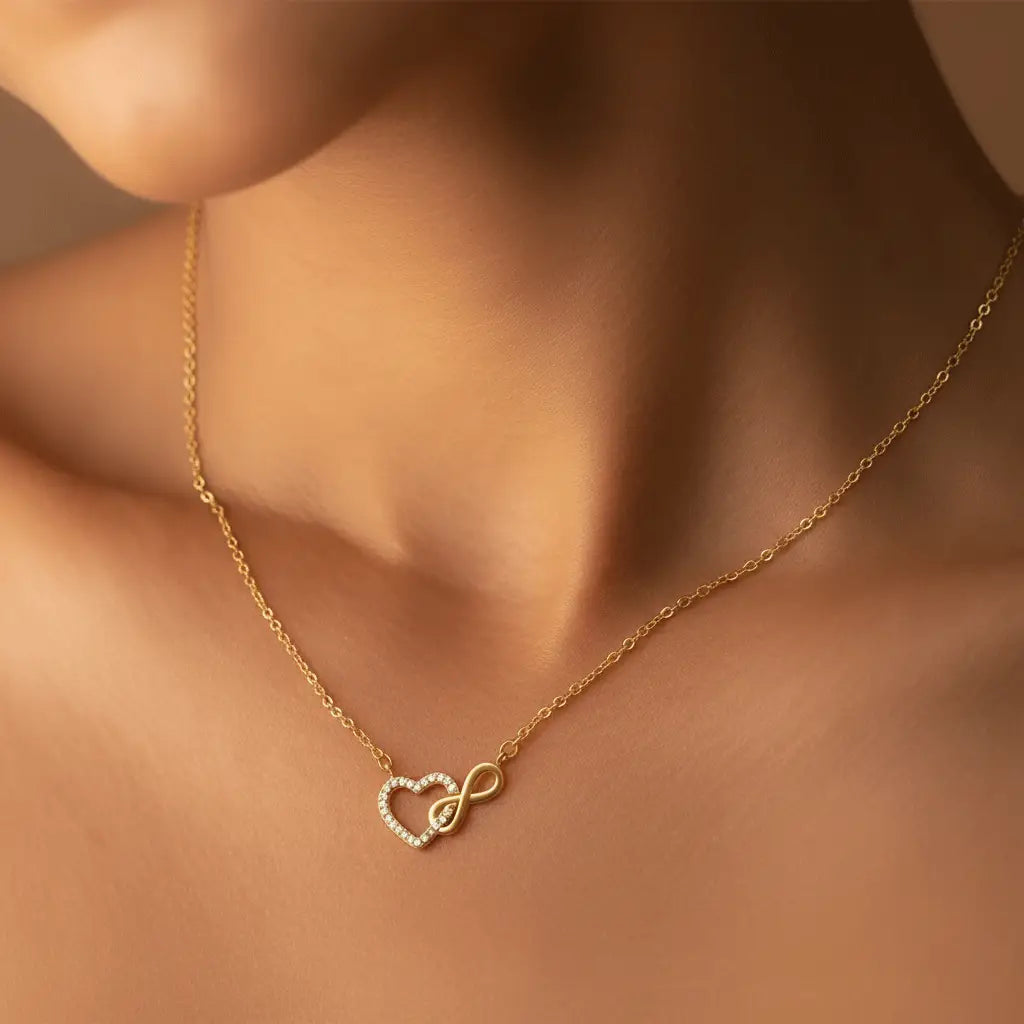 A delicate necklace with a heart-shaped pendant intertwined with an infinity symbol, accented with small crystals.
