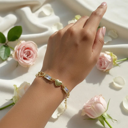 Anti-tarnish heart-link gold bracelet features a stylish chain design with a heart and crystal charms.