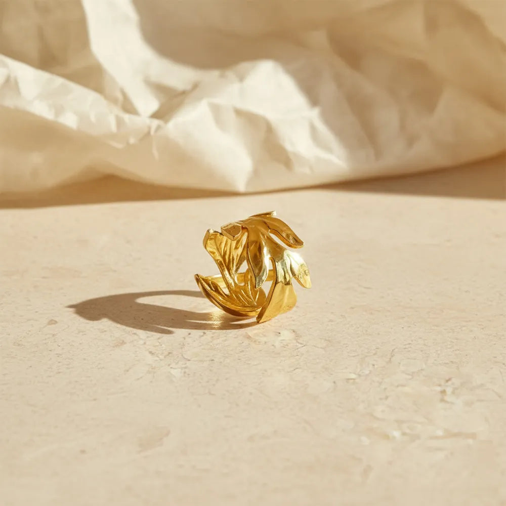 This golden swirl ring features a unique twisted design with Adjustable pattern.