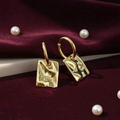 Square Drops, featuring a unique textured finish that adds a modern touch to any outfit.