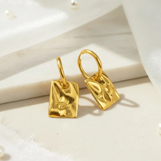 Square Drops, featuring a unique textured finish that adds a modern touch to any outfit.