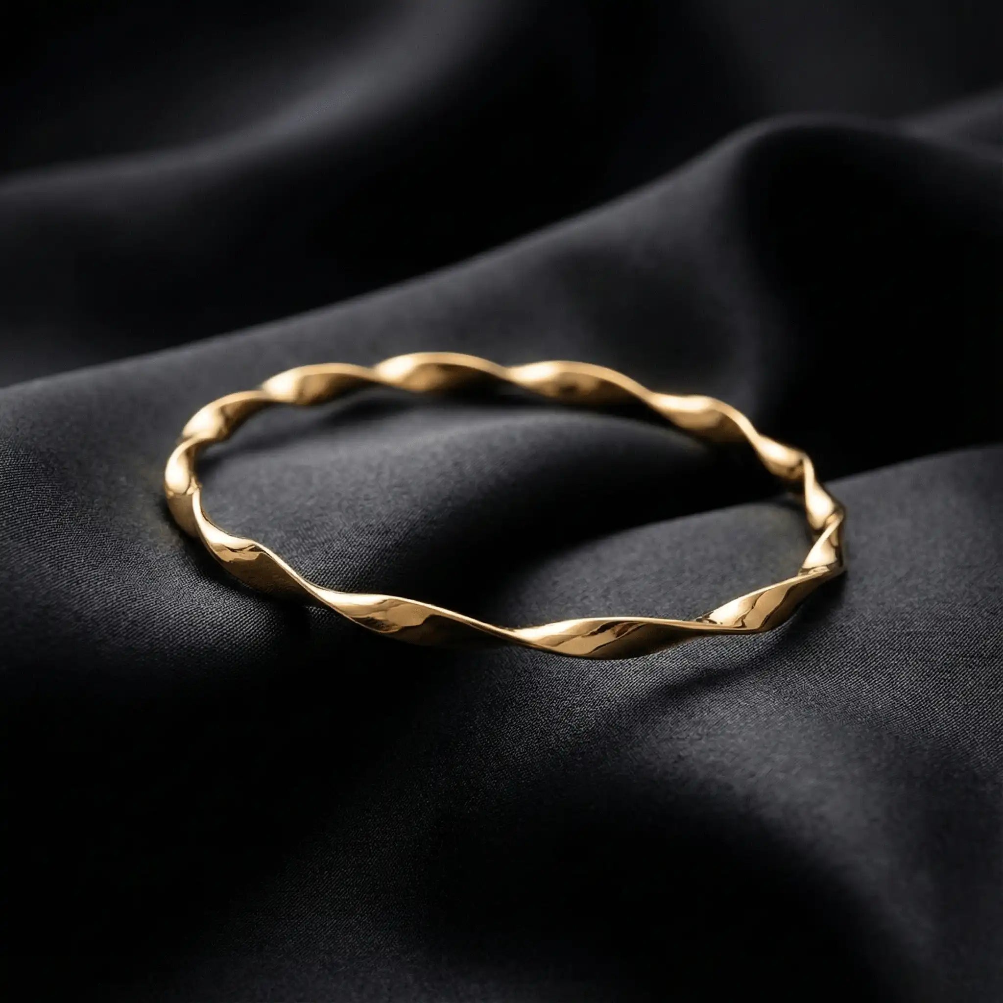2 Swirl Gold Bangle anti-tarnish gold swirl bangle styled on black luxury fabric