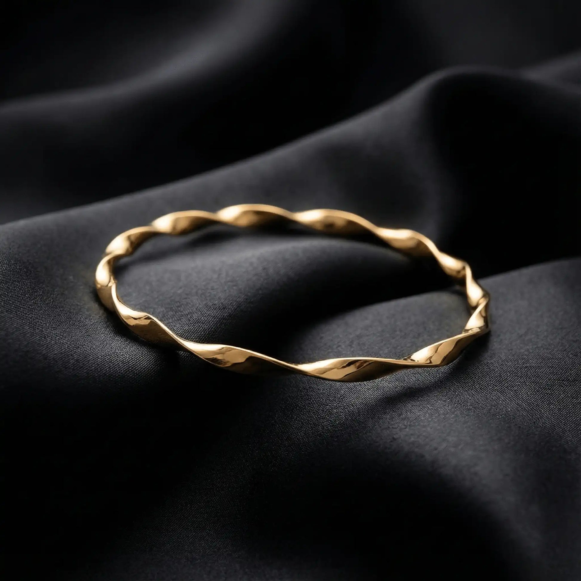 2 Swirl Gold Bangle anti-tarnish gold swirl bangle styled on black luxury fabric