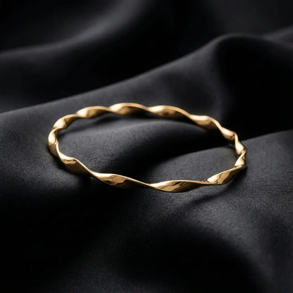 2 Swirl Gold Bangle anti-tarnish gold swirl bangle styled on black luxury fabric
