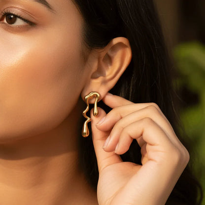  Abstract Gold Drops. These anti-tarnish earrings feature modern shapes in shiny gold for a fresh, artsy look. 
