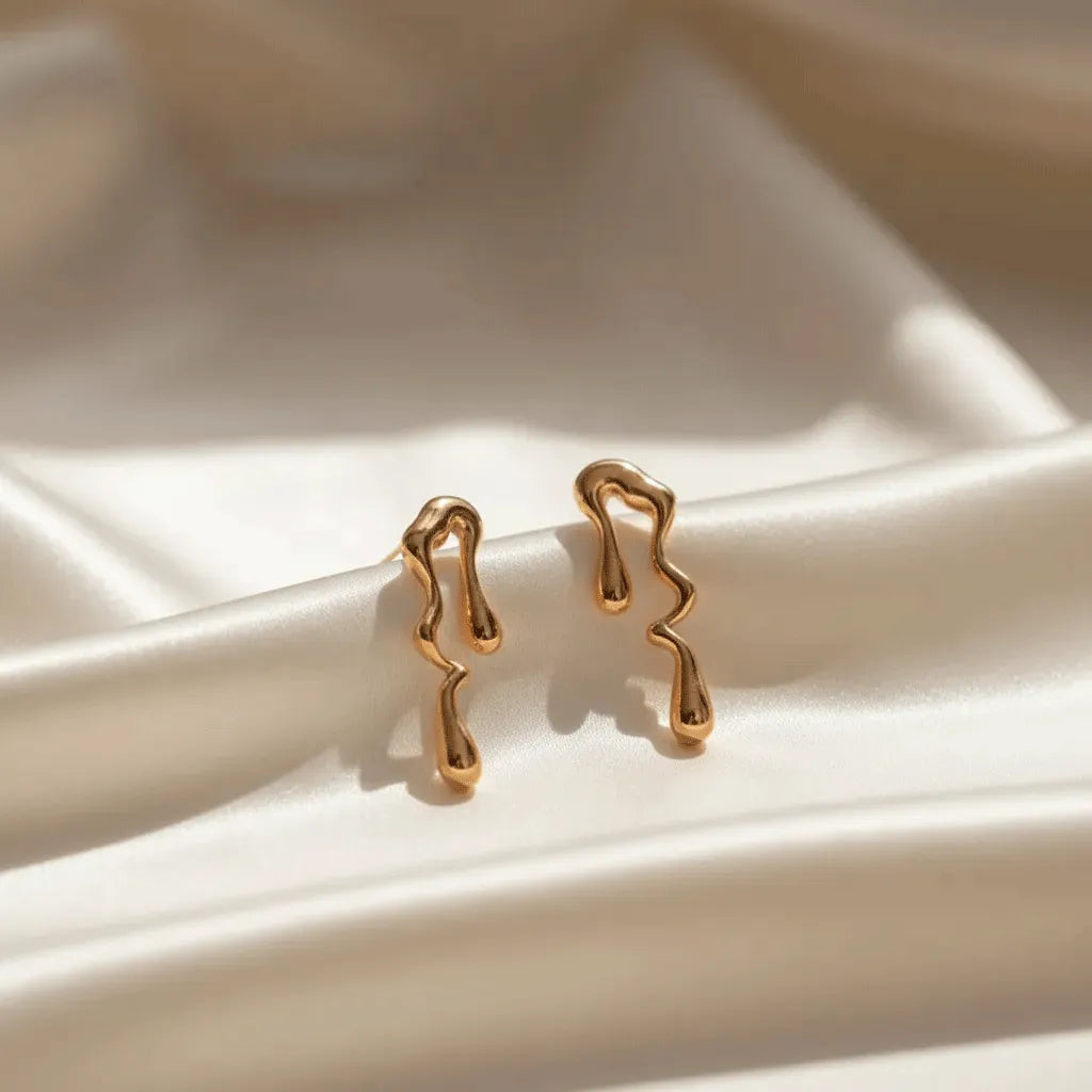 anti tarnish earrings on a white ceramic cloth