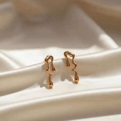 anti tarnish earrings on a white ceramic cloth