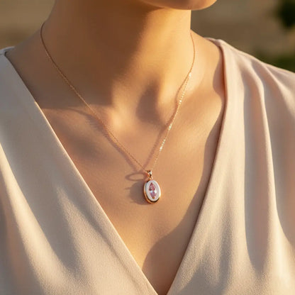 Close-up of the Blush Stone Pendant – Anti-Tarnish rose-gold necklace with a pink marquise gemstone, worn by a woman in warm sunset light.