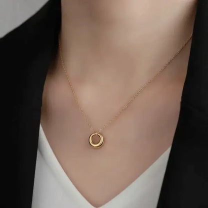 Classic Circle Pendant Necklace – elegant gold circle charm worn on model for minimalist everyday style