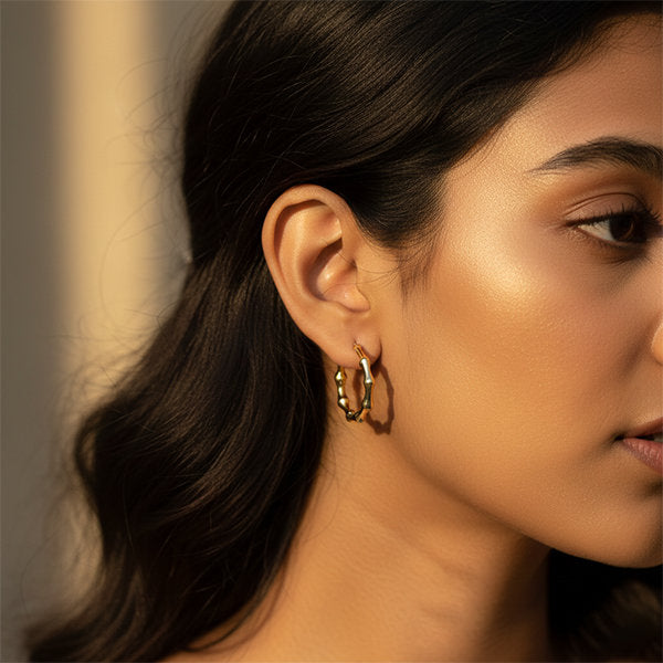 Gold textured ripple hoop earrings worn by Indian model – lightweight anti-tarnish jewellery