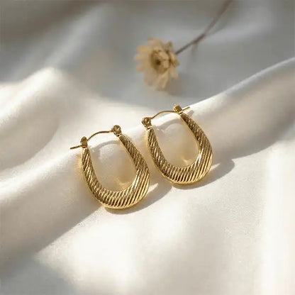 Classic Textured Hoops Anti-Tarnish earrings on white satin background