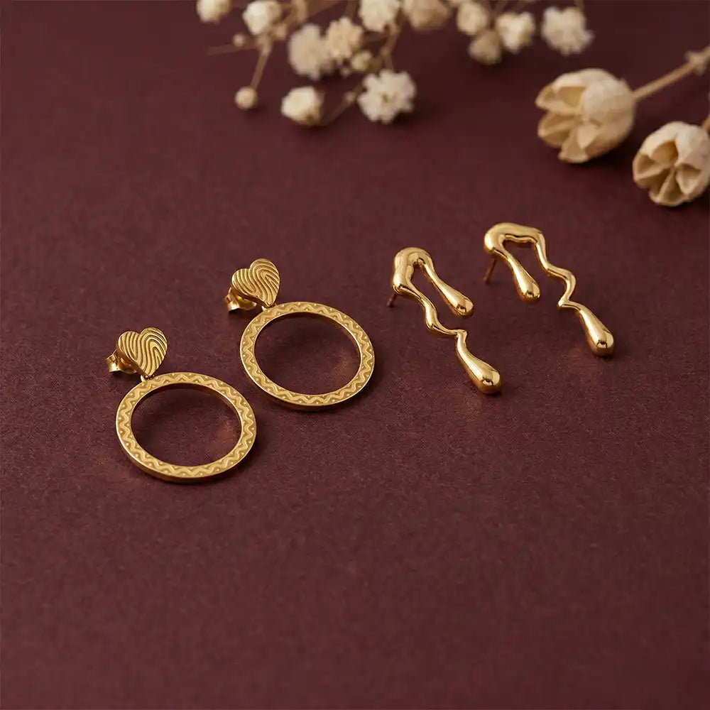 K-A Trends anti tarnish gold earrings combo with textured circle drop earrings and abstract wavy studs on maroon background