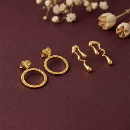 K-A Trends anti tarnish gold earrings combo with textured circle drop earrings and abstract wavy studs on maroon background