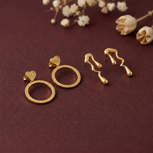 K-A Trends anti tarnish gold earrings combo with textured circle drop earrings and abstract wavy studs on maroon background