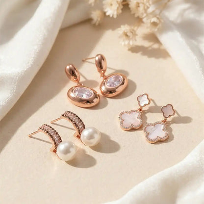 K-A Trends anti tarnish rose gold earrings combo featuring pearl drop studs, crystal oval drops and clover dangle earrings elegant party wear