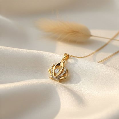 Crystal Crown Pendant anti-tarnish gold crown pendant with crystal detailing on white satin