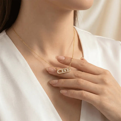 Woman wearing elegant gold crystal link pendant necklace with anti-tarnish finish and minimalist luxury design by K-A Trends