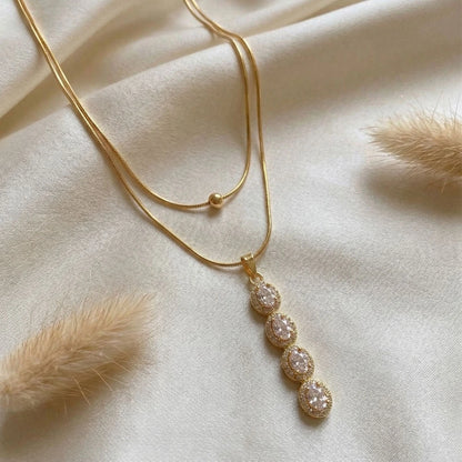 Crystal Drop Layered Pendant - Anti-Tarnish on a white satin cloth.