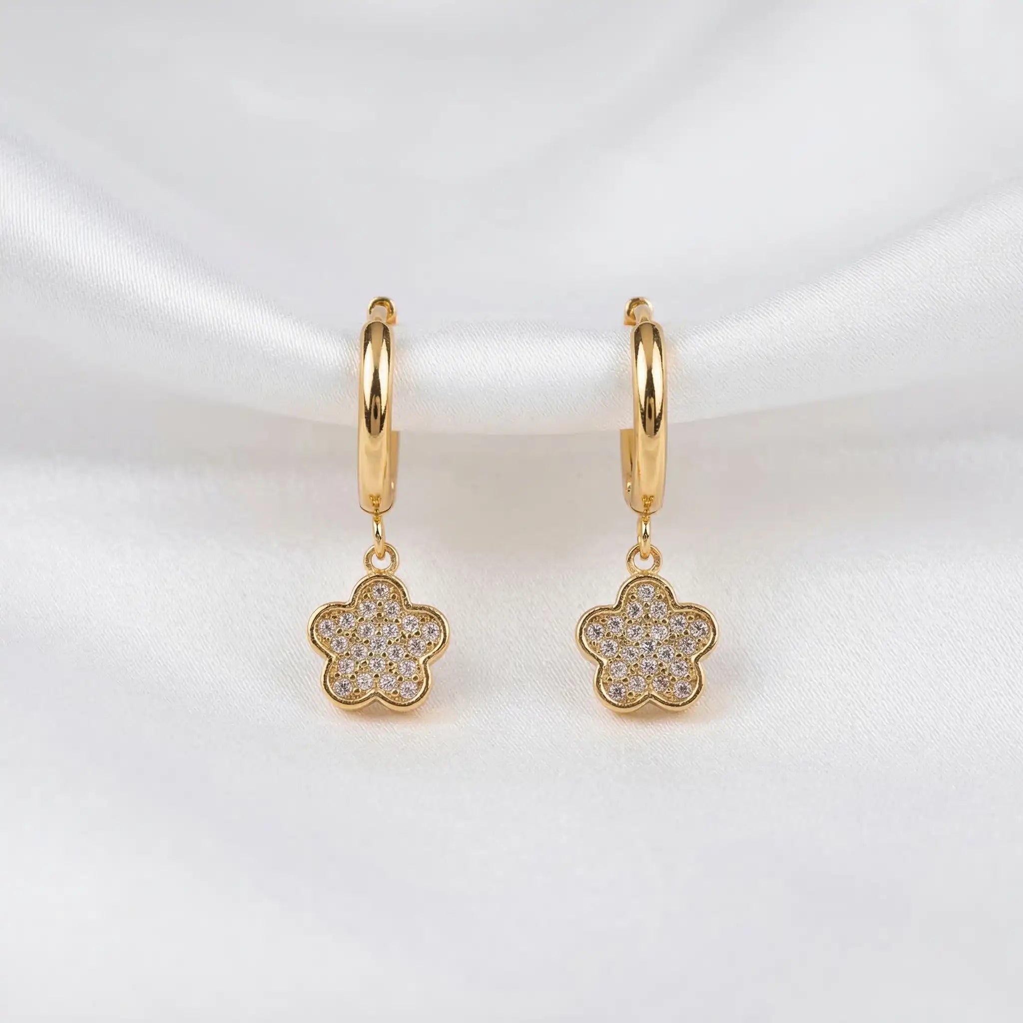 Crystal Flower Hoops with floral charms on a white background