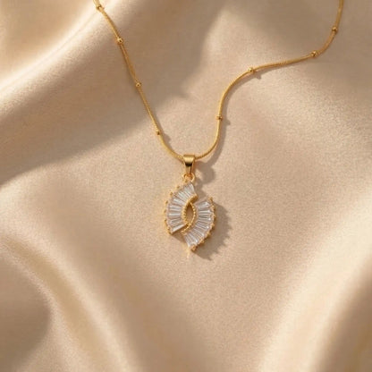 Crystal Halo Fan Penadant on a beige fabric background