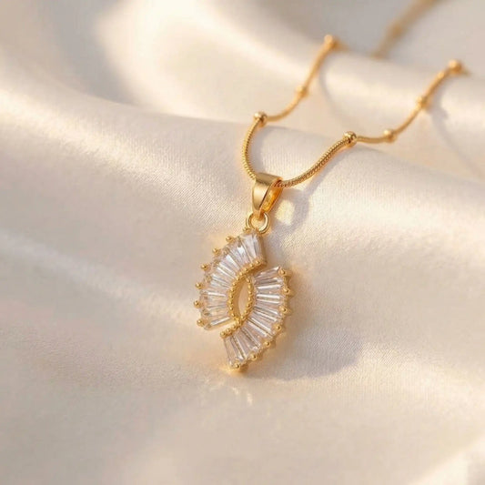 Crystal Halo Fan Penadant on a soft fabric background