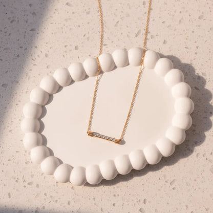 Simple bar design necklace that complements both casual and dressy looks