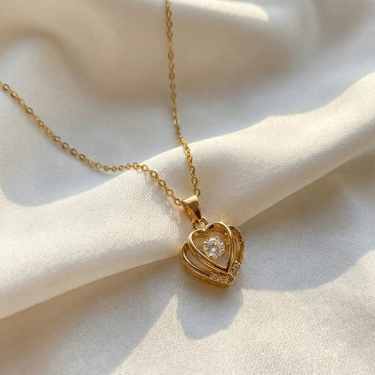 Double Heart Glow Pendant anti-tarnish gold heart pendant necklace on white satin