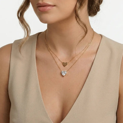 Model wearing double layer heart pendant necklace in gold finish, anti tarnish everyday necklace for women