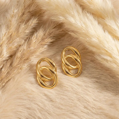 K-A Trends anti tarnish gold double loop stud earrings on soft beige fur background premium minimalist jewellery flatlay
