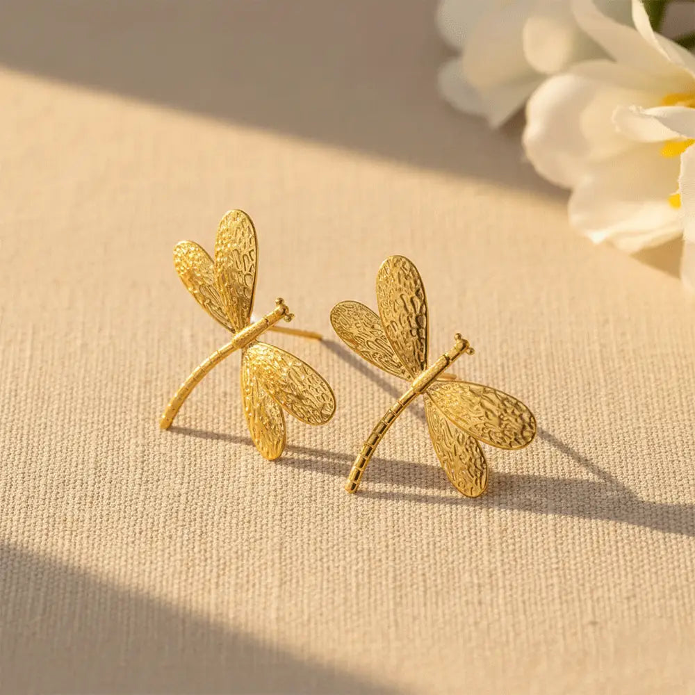 K-A Trends anti tarnish gold dragonfly stud earrings on beige fabric luxury minimalist jewellery flatlay