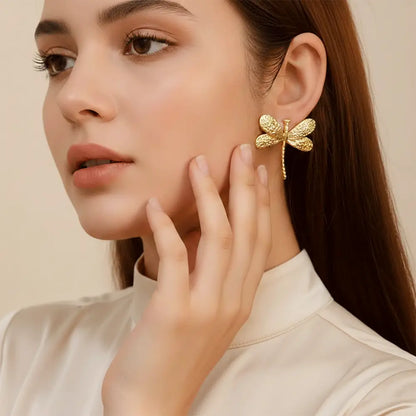 K-A Trends anti tarnish gold dragonfly stud earrings worn by female model elegant lifestyle jewellery look