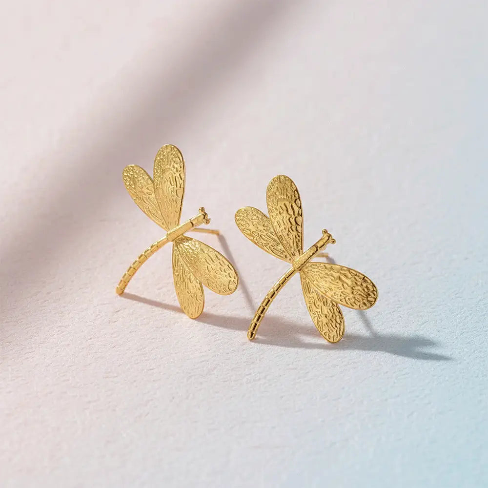 K-A Trends anti tarnish gold dragonfly stud earrings on neutral background premium minimalist product shoot