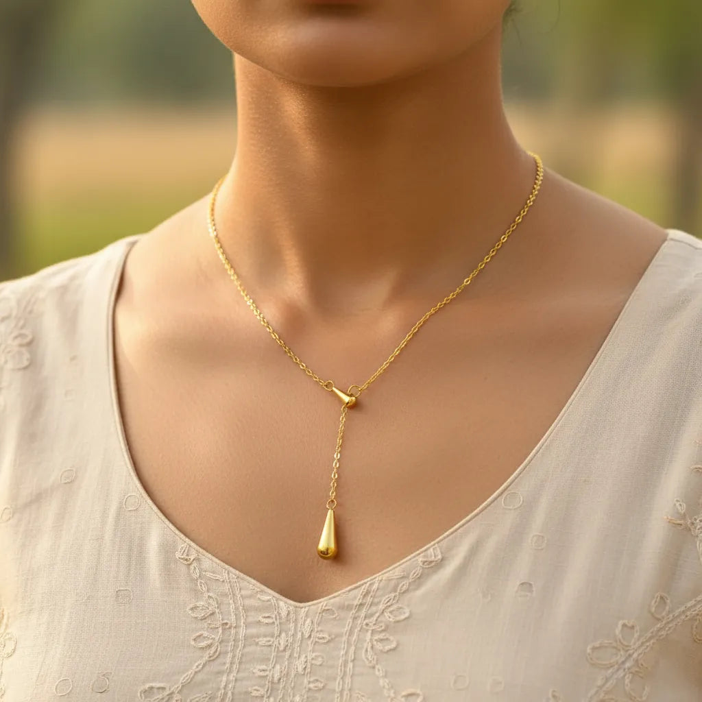 Gold-plated drop pendant necklace with sleek teardrop design, minimal gold jewellery for women suitable for any outfit or occasion.