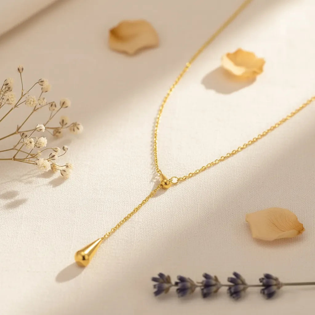Gold-plated drop pendant necklace with sleek teardrop design, minimal gold jewellery for women suitable for any outfit or occasion.