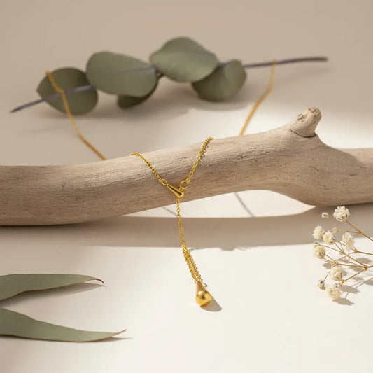 Gold-plated drop pendant necklace with sleek teardrop design, minimal gold jewellery for women suitable for any outfit or occasion.