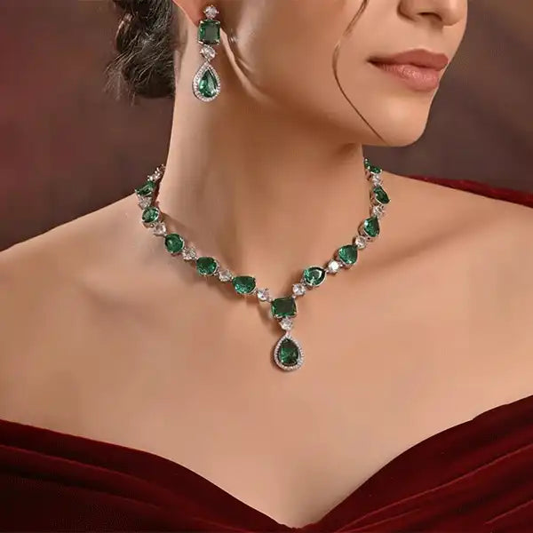 Evergreen Royale Necklace Set worn by model, emerald green necklace and earrings in silver finish