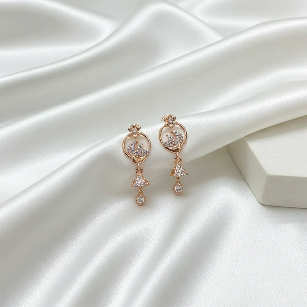 Rose gold floral AD drop earrings on white satin background, lightweight anti tarnish party wear earrings