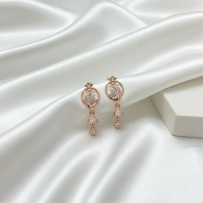 Rose gold floral AD drop earrings on white satin background, lightweight anti tarnish party wear earrings