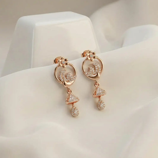 Close up of floral spark AD drop earrings with crystal detailing, rose gold anti tarnish jewellery