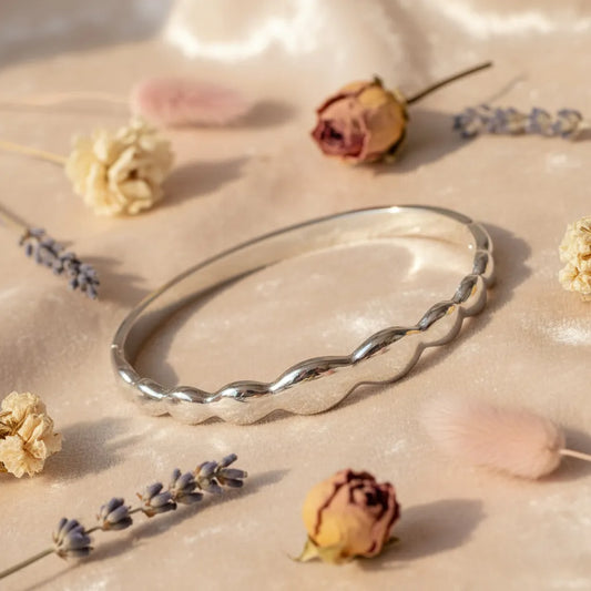 Silver Wave bracelet is a sleek and modern piece with smooth wave links which add a stylish touch.