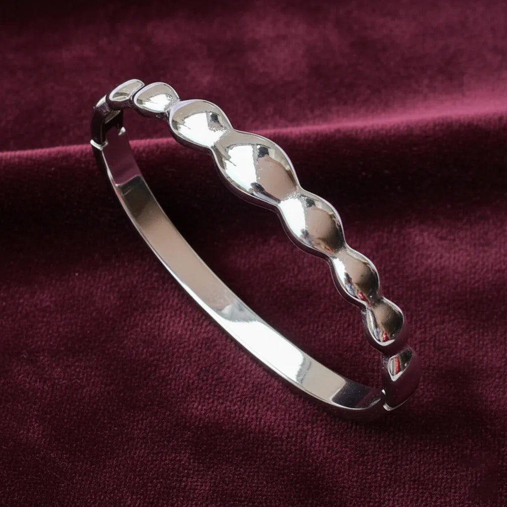 Silver Wave bracelet is a sleek and modern piece with smooth wave links which add a stylish touch.