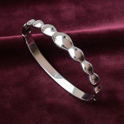 Silver Wave bracelet is a sleek and modern piece with smooth wave links which add a stylish touch.