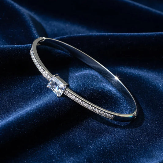 This sleek lightweight  anti-tarnish bracelet features a stunning stone at the center, set on a polished band.