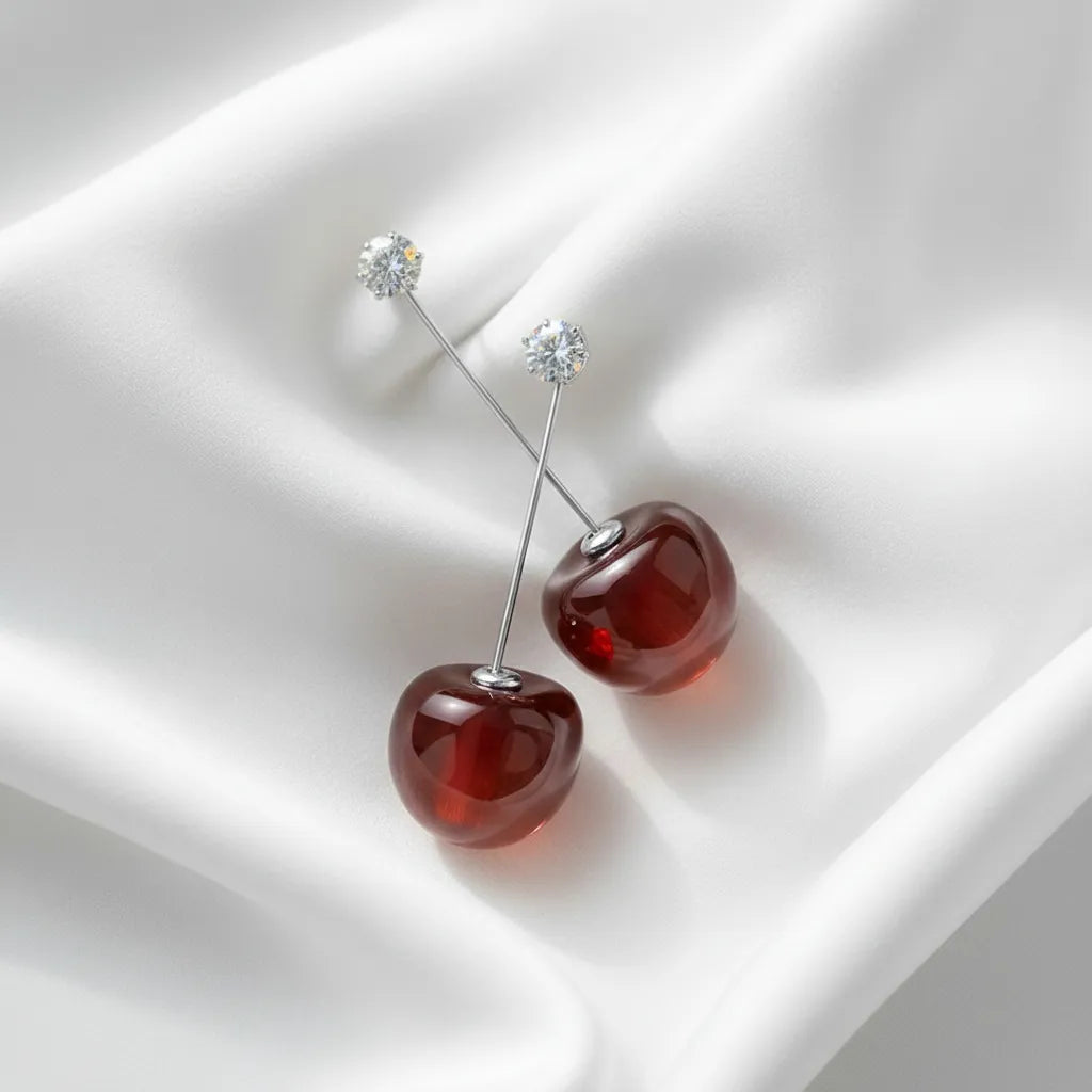 Cherry-red earrings makes a bold statement with their vibrant design, adding a fresh touch to any outfit.